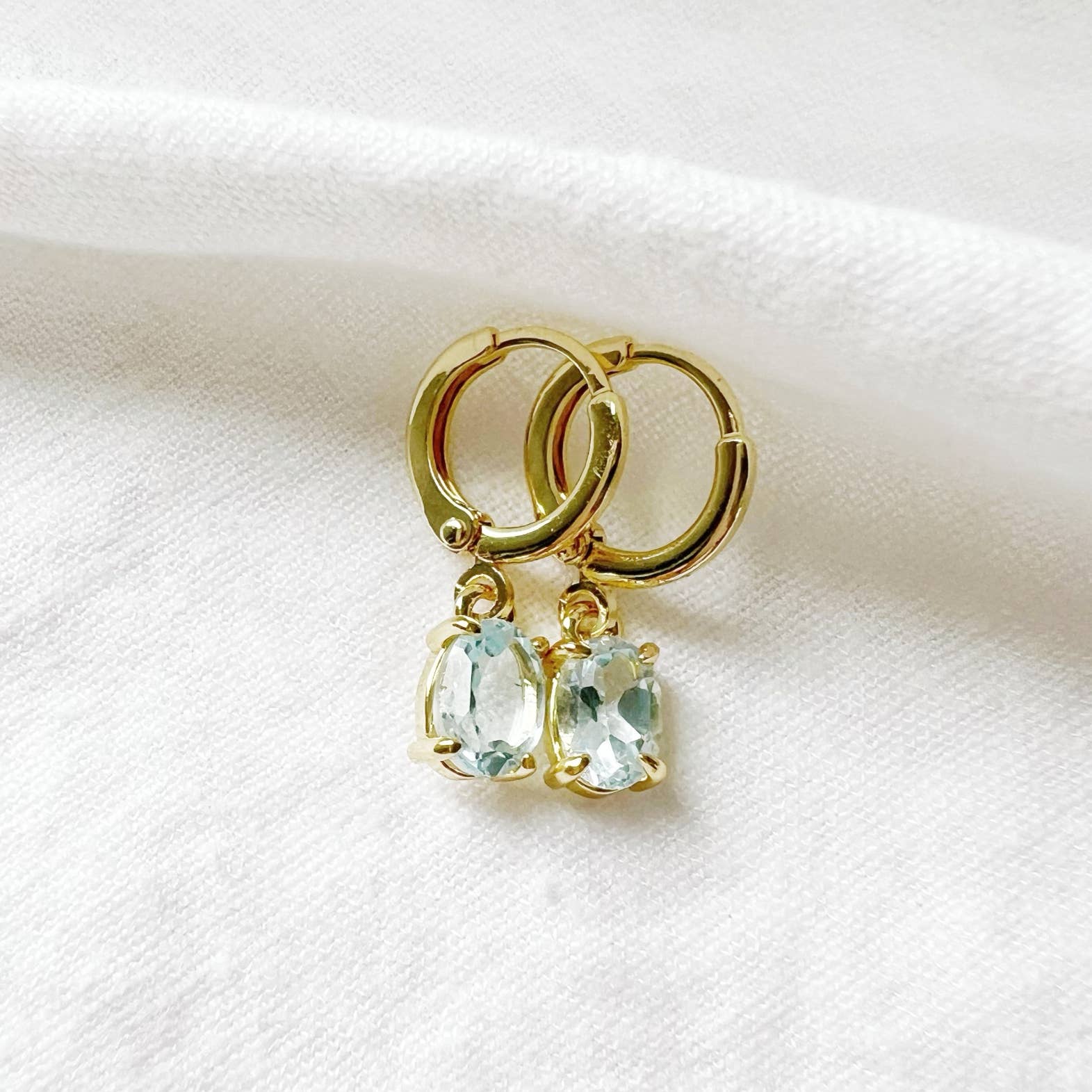 Laguna Blue CZ Huggie Hoops Earrings