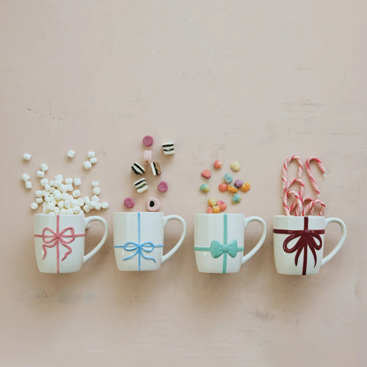 Stoneware Mug with Embossed Bow,